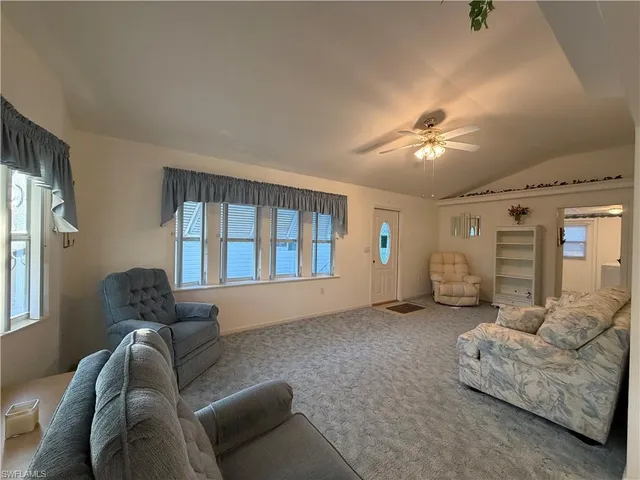 a living room with furniture and windows