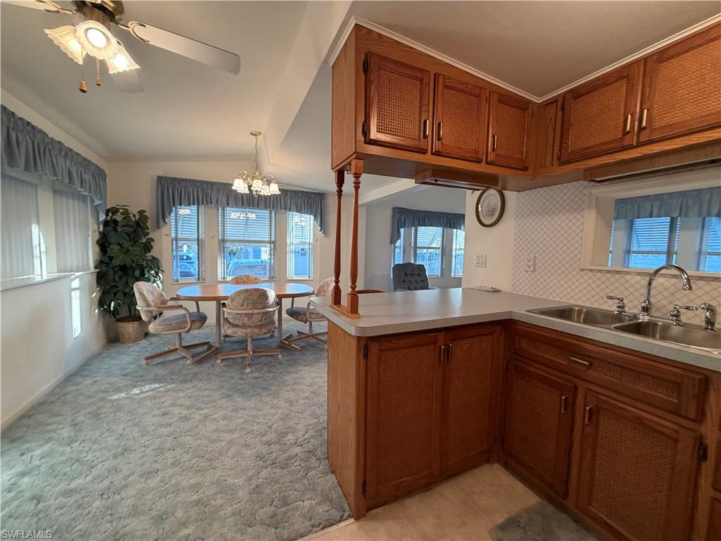 4680 Washington Way West Estero, FL 33928 - Photo 7 of 19 a kitchen with sink cabinets and window