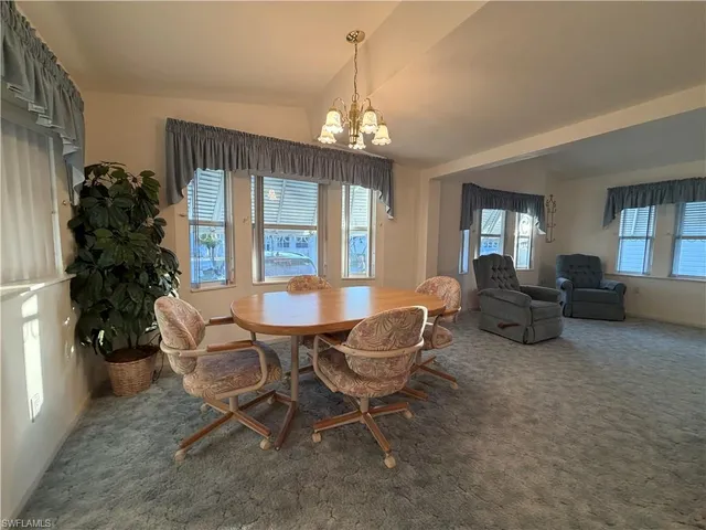 a view of a livingroom with furniture window and wooden floor