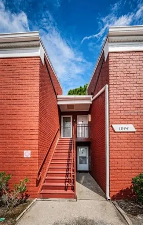 a view of a house with wooden stairs