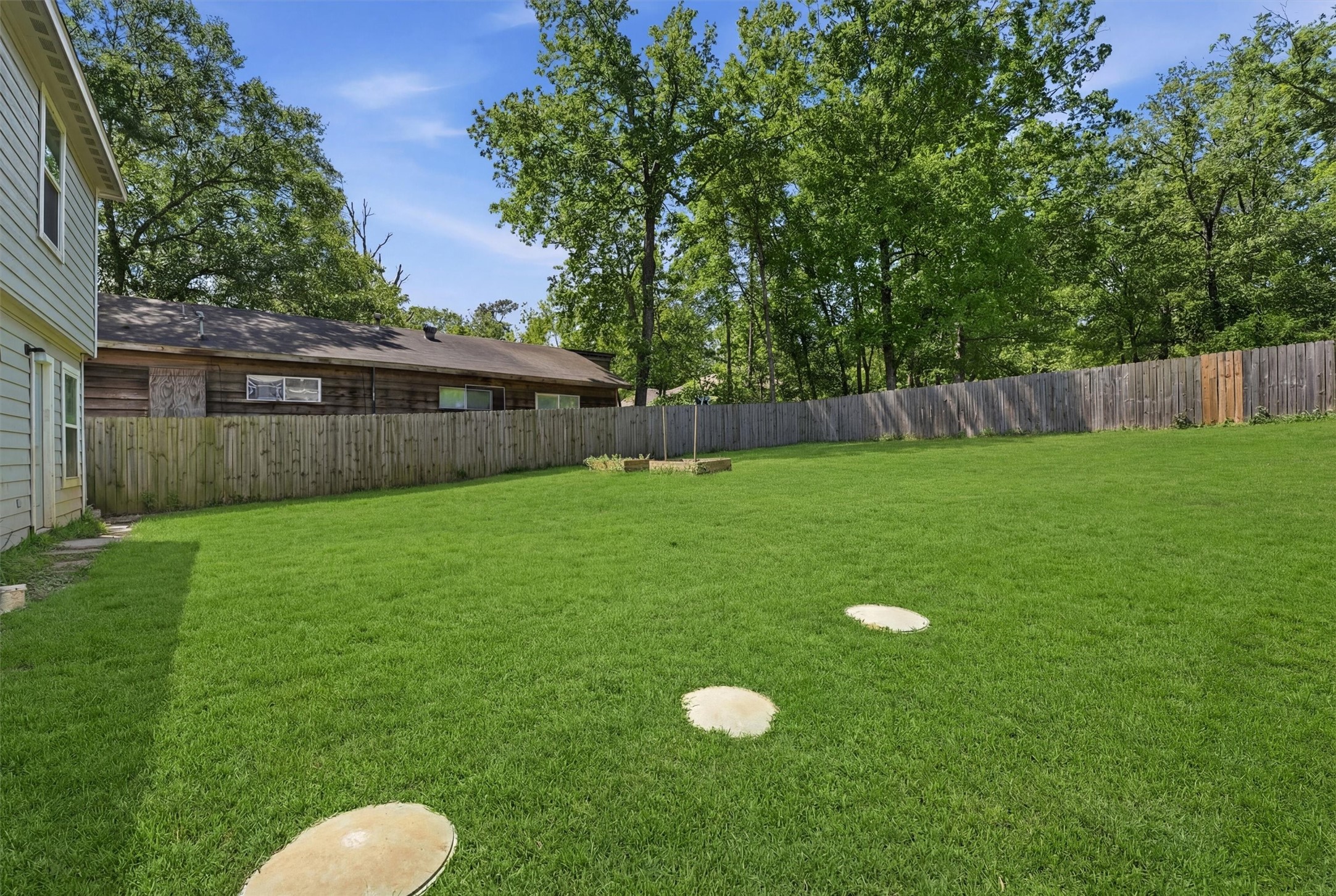 15011 Crockett Road Willis, TX 77378 - Photo 19 of 24 Generous backyard with endless outdoor potential.
