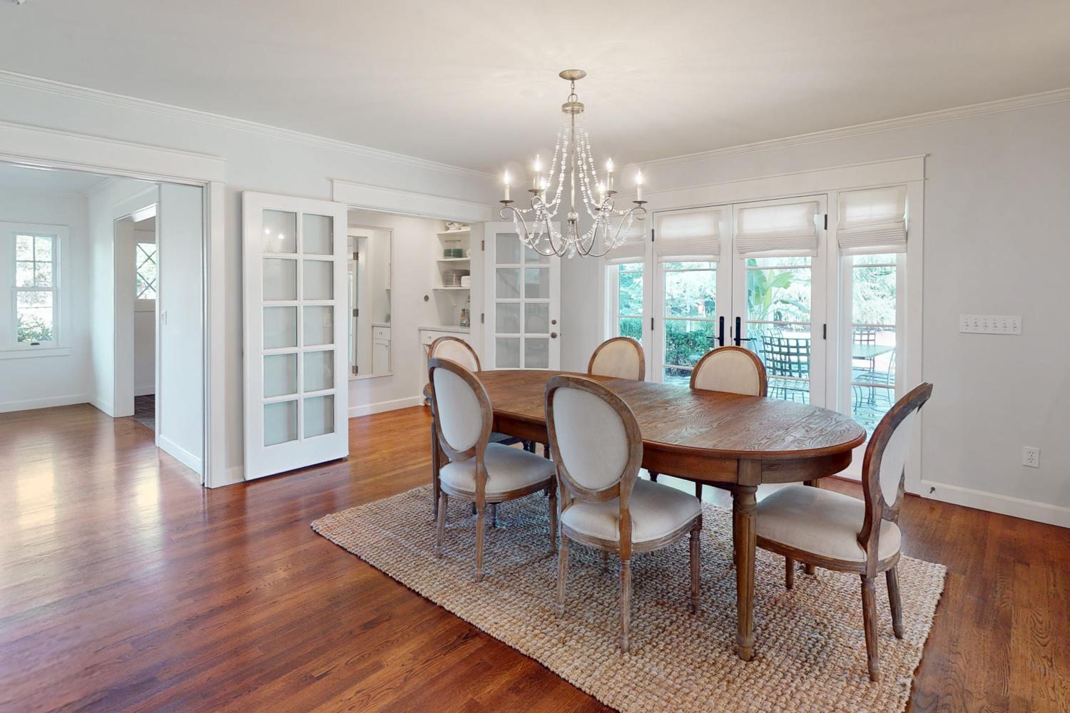 332 Wilson Road Yuba City, CA 95991 - Photo 14 of 91 a view of a dining room with furniture wooden floor and chandelier