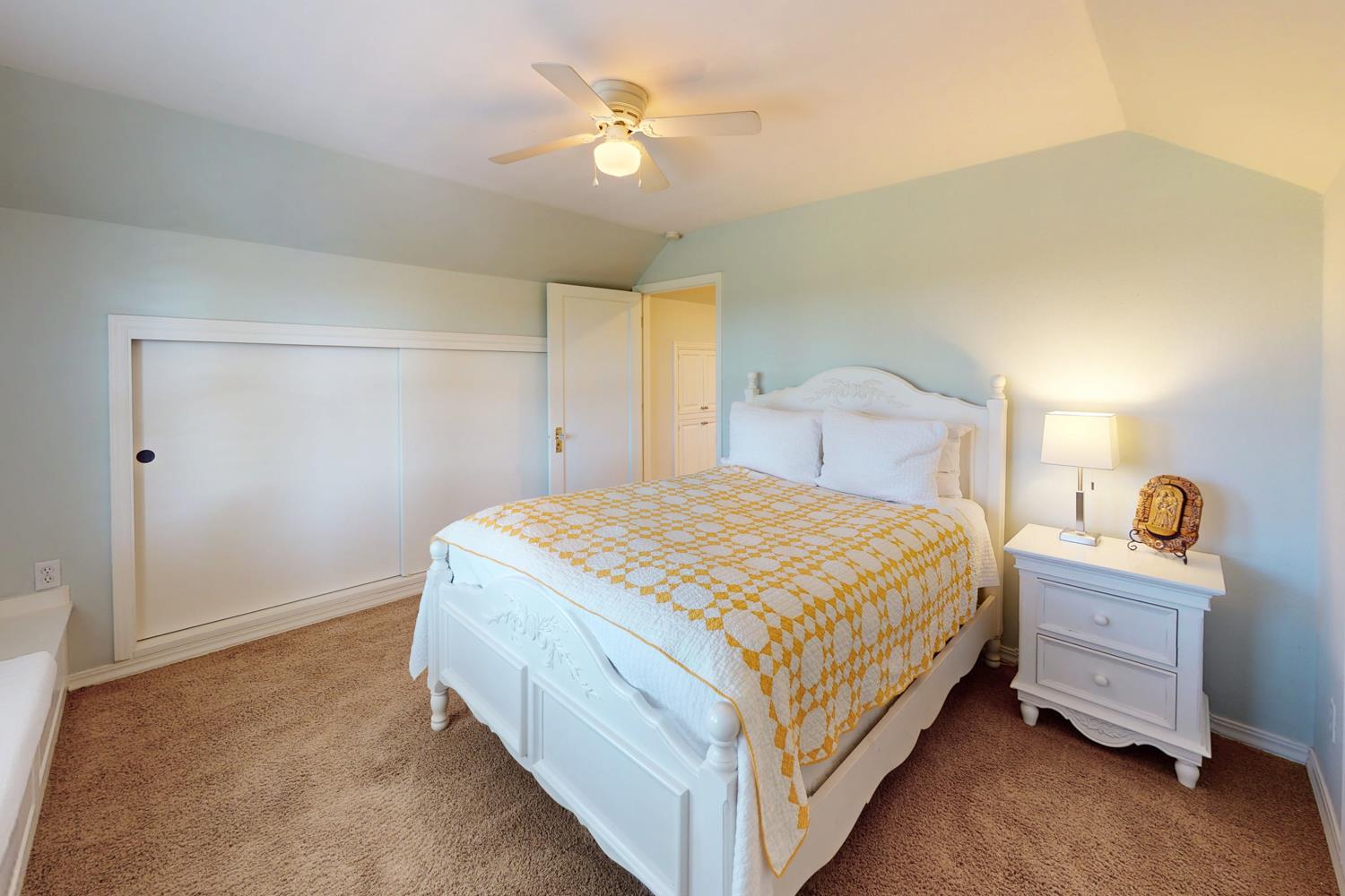 332 Wilson Road Yuba City, CA 95991 - Photo 44 of 91 a spacious bedroom with a bed and a ceiling fan