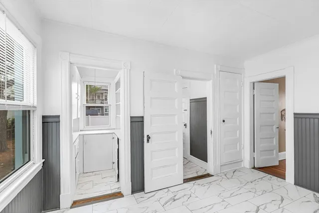 a view of a bathroom with a shower and closet