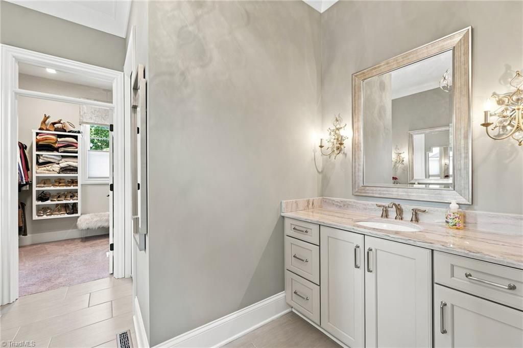 5306 Rockingham Road East Greensboro, NC 27407 - Photo 17 of 47 Dual vanities, 2 walk-in closets and more in this Primary Bath.