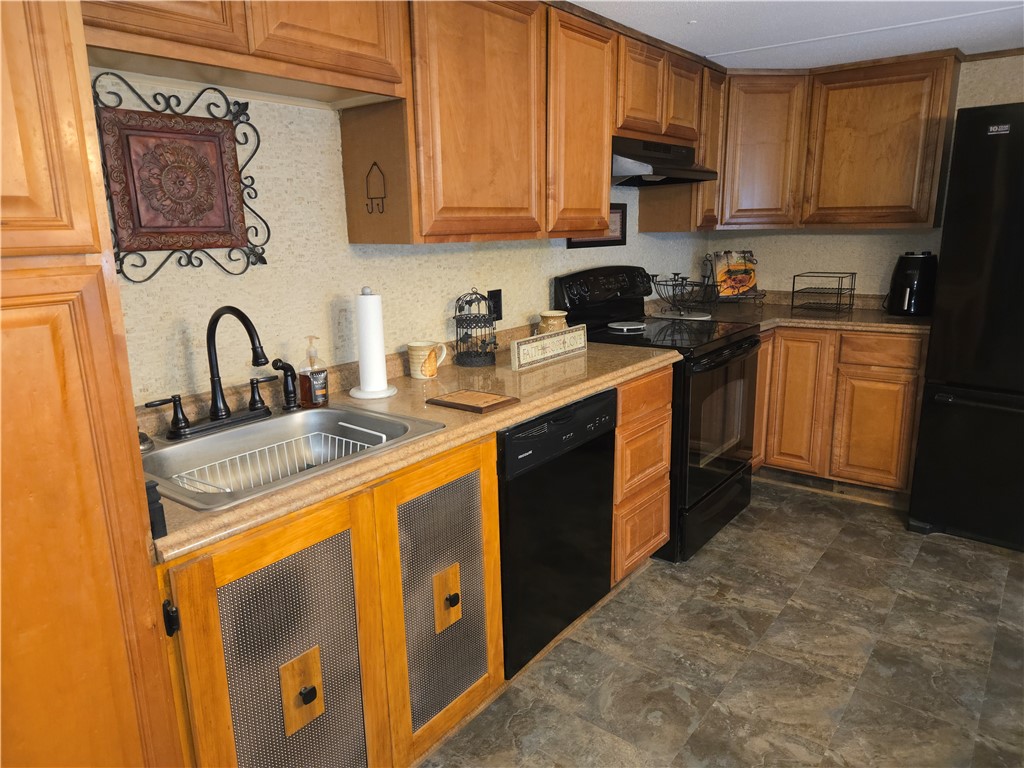 238 Forest Lane Starr, SC 29684 - Photo 2 of 11 A functional kitchen boasts ample cabinetry and essential appliances for everyday living.