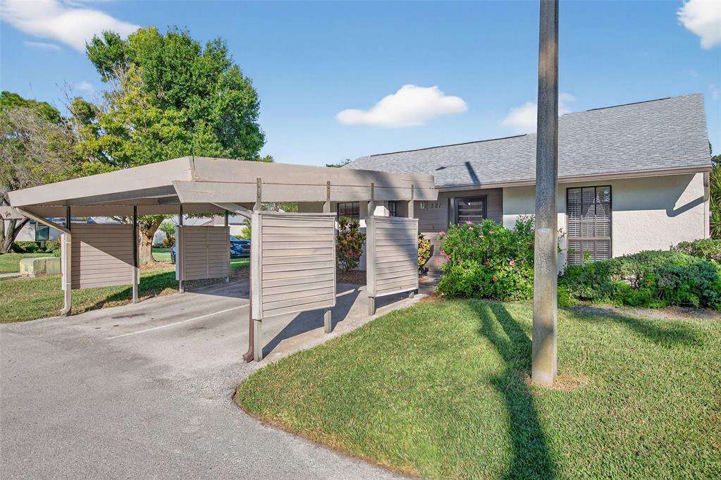 a view of a house with a yard and garage