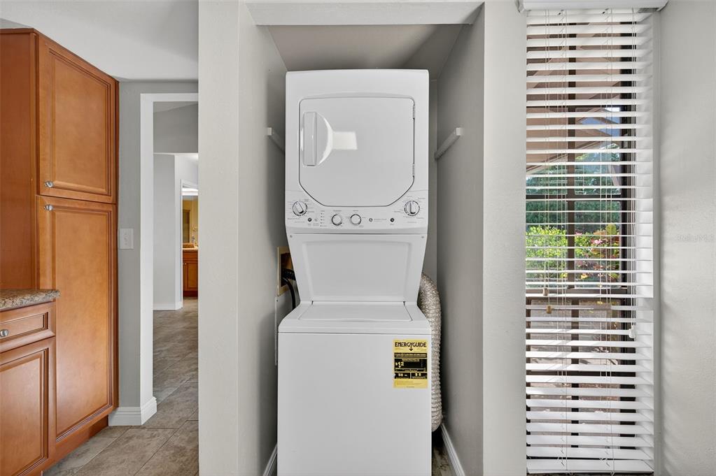 321 Windrush Loop Tarpon Springs, FL 34689 - Photo 11 of 47 a utility room with dryer and washer