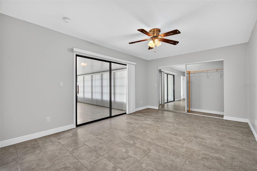 321 Windrush Loop Tarpon Springs, FL 34689 - Photo 17 of 47 a view of an empty room with a window
