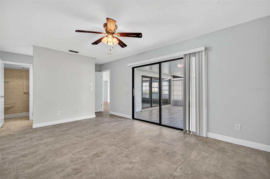 321 Windrush Loop Tarpon Springs, FL 34689 - Photo 18 of 47 a view of empty room with ceiling fan