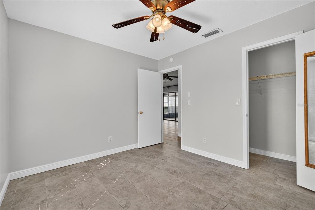 321 Windrush Loop Tarpon Springs, FL 34689 - Photo 24 of 47 a view of an empty room with window and a kitchen