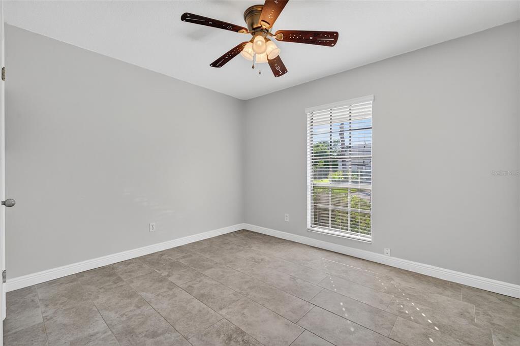 321 Windrush Loop Tarpon Springs, FL 34689 - Photo 25 of 47 a view of an empty room with a window