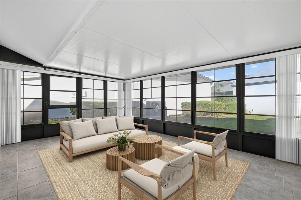 321 Windrush Loop Tarpon Springs, FL 34689 - Photo 30 of 47 a living room with furniture and a large window