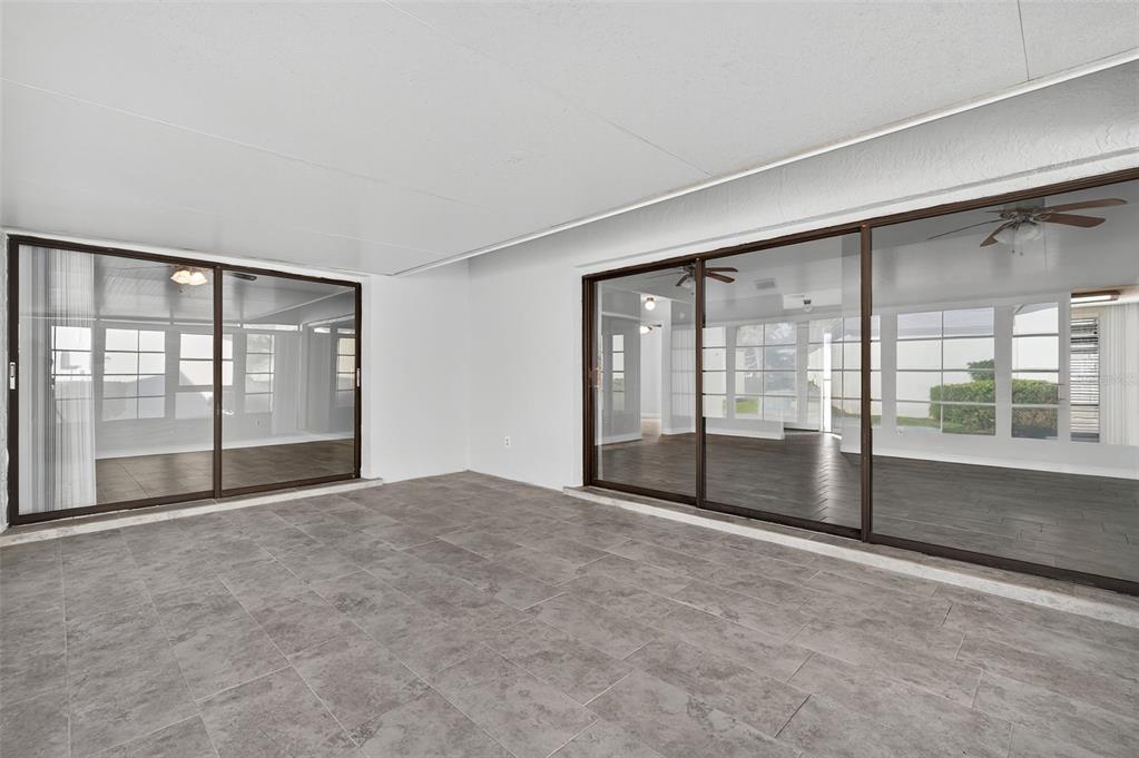 321 Windrush Loop Tarpon Springs, FL 34689 - Photo 33 of 47 a view of an empty room with glass door