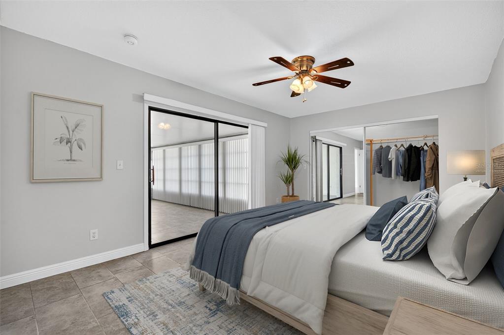 321 Windrush Loop Tarpon Springs, FL 34689 - Photo 4 of 47 a bedroom with a large bed and a window