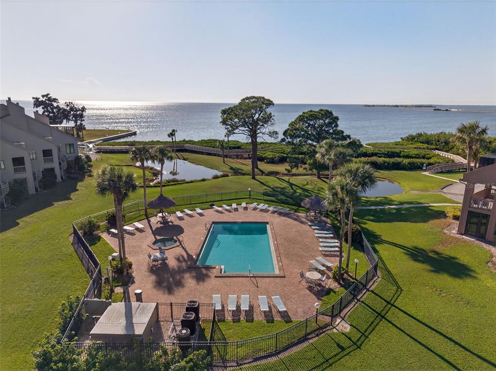 321 Windrush Loop Tarpon Springs, FL 34689 - Photo 5 of 47 an aerial view of a house with a garden