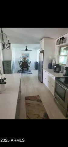 a view of a kitchen with a sink
