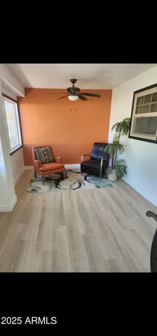 a view of kitchen with furniture and a gate