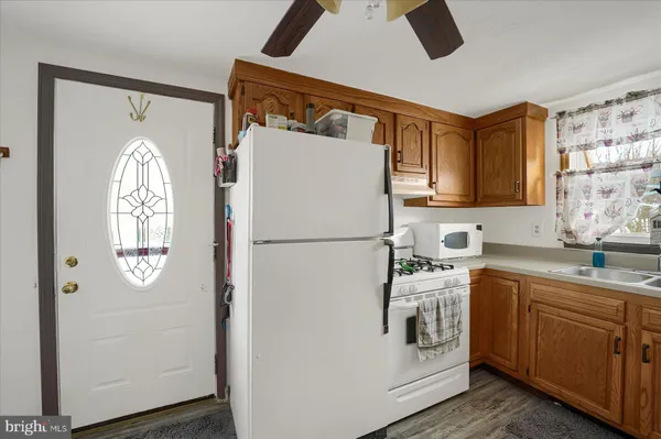a white refrigerator freezer sitting inside of a kitchen