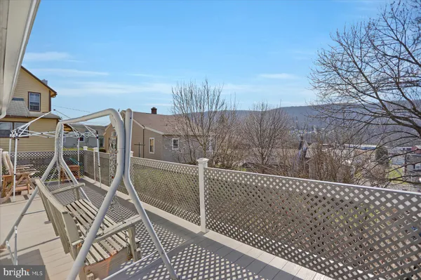 a view of balcony with furniture
