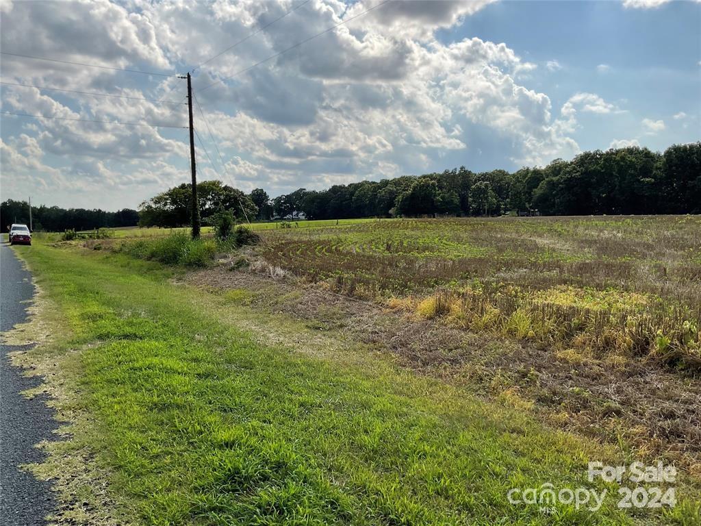 0 Ledbetter-Ford Road Oakboro, NC 28129 - Photo 6 of 7 a view of a lake with houses in the back