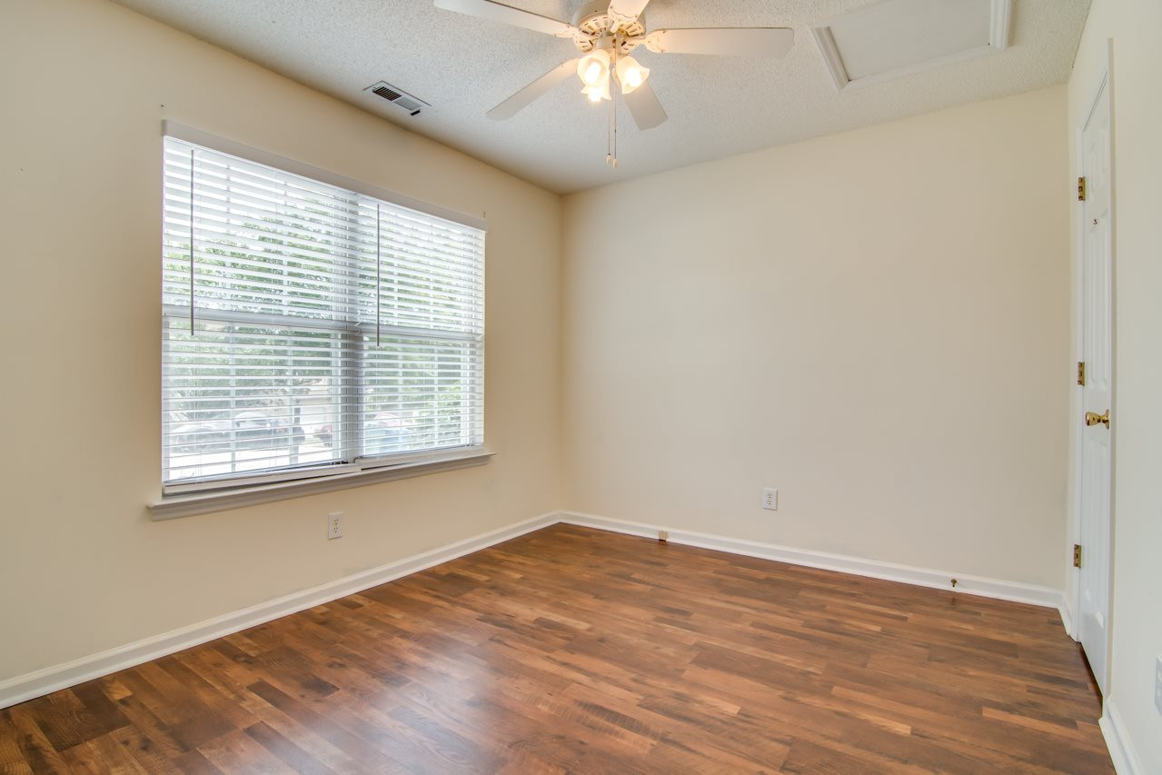 5008 Gable Ridge Drive Durham, NC 27713 - Photo 15 of 20 a view of an empty room with wooden floor and a window
