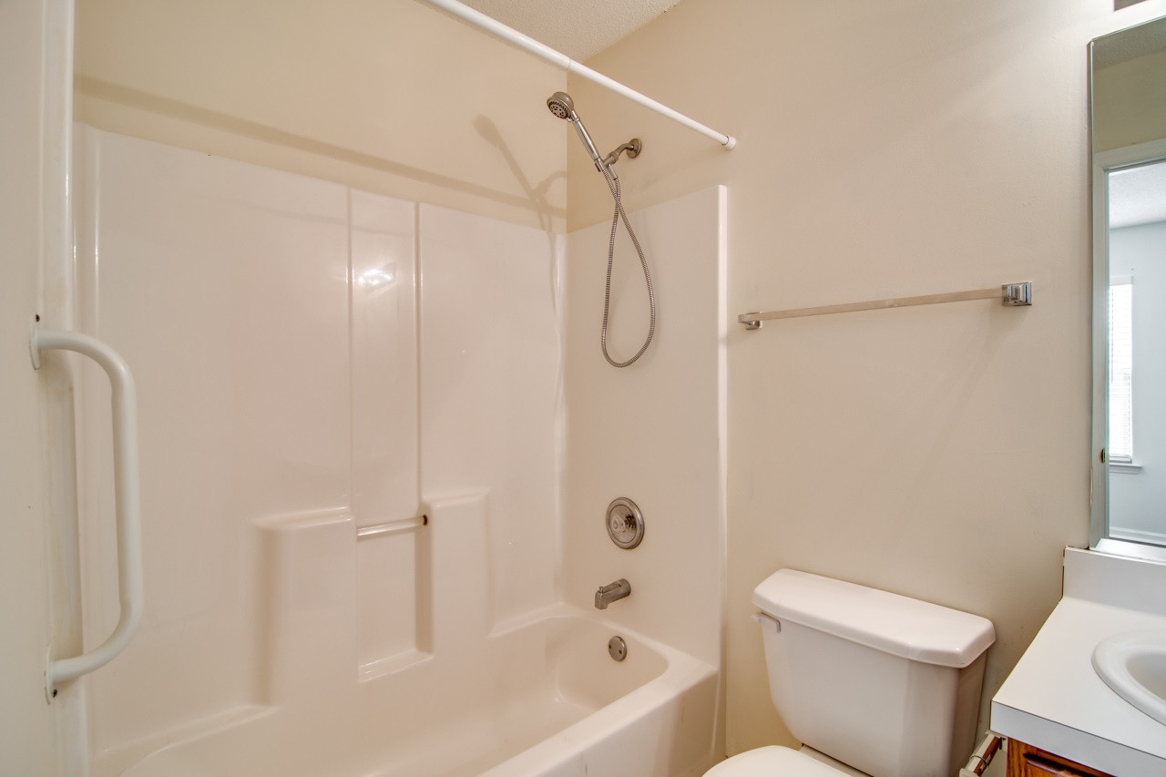 5008 Gable Ridge Drive Durham, NC 27713 - Photo 16 of 20 a bathroom with a toilet and a shower