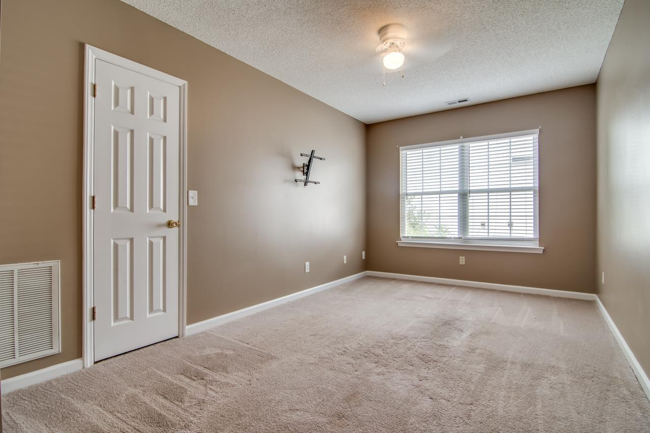 5008 Gable Ridge Drive Durham, NC 27713 - Photo 18 of 20 an empty room with windows