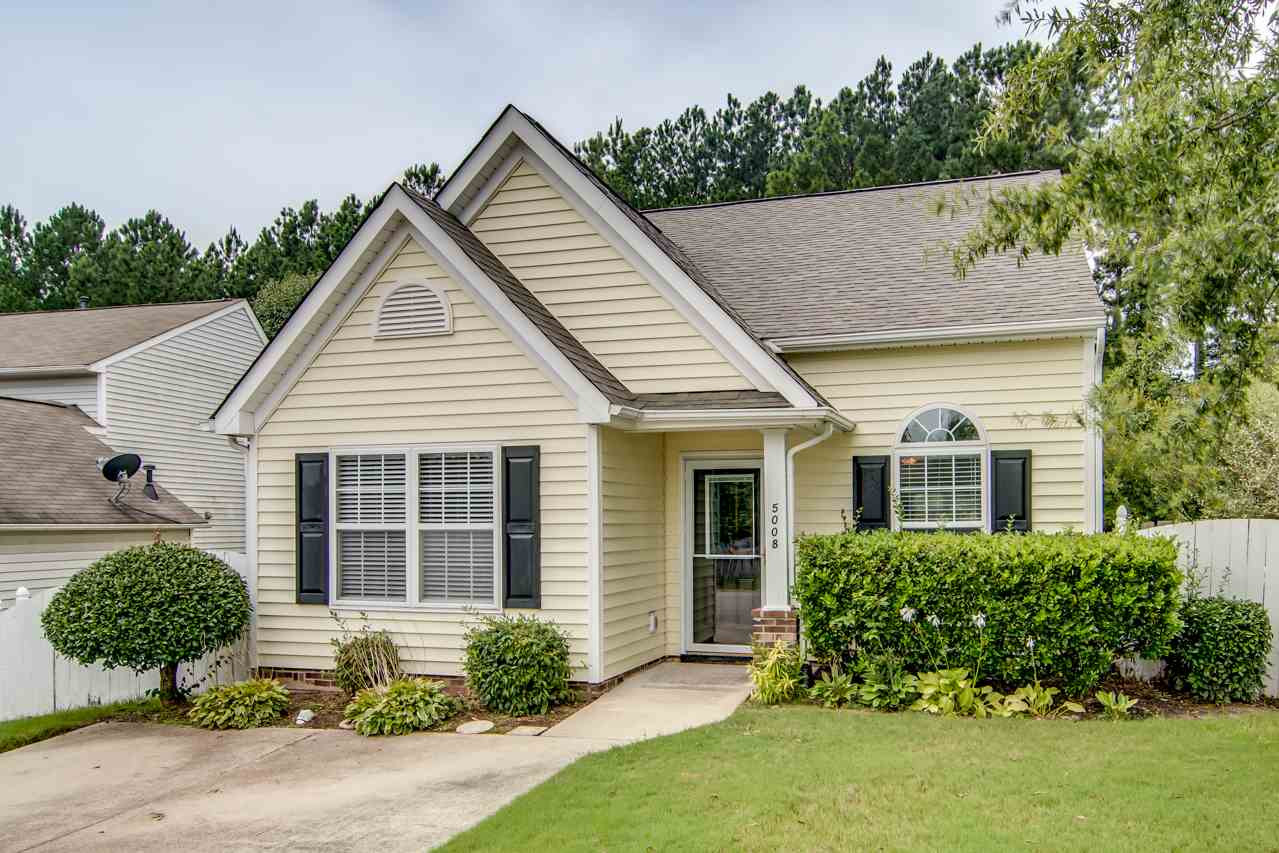 5008 Gable Ridge Drive Durham, NC 27713 - Photo 2 of 20 a view of a white house next to a yard with potted plants