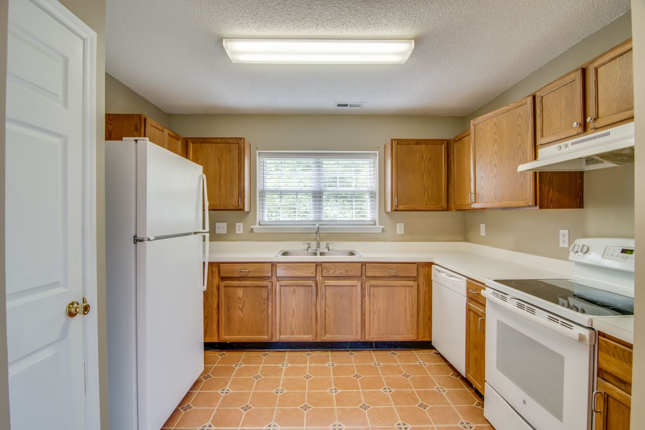 5008 Gable Ridge Drive Durham, NC 27713 - Photo 10 of 20 a kitchen with a sink appliances and cabinets