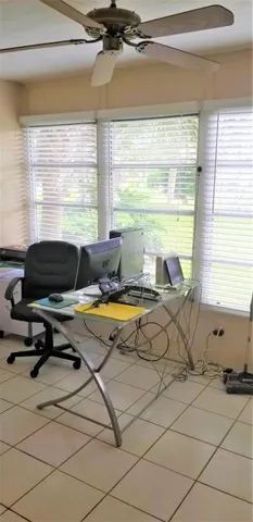 a living room with a large window and a table