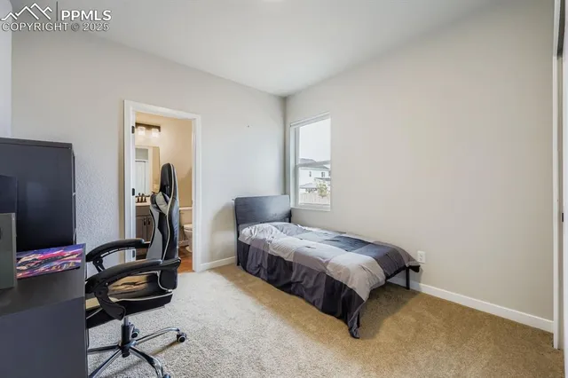 a bathroom with a sink a toilet a mirror and shower