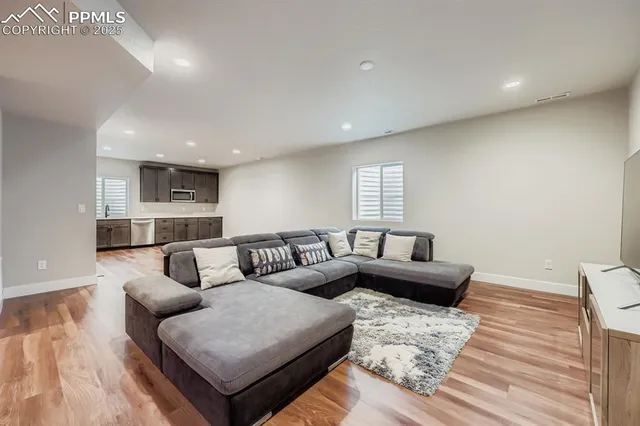 a bedroom with a bed couch and a window