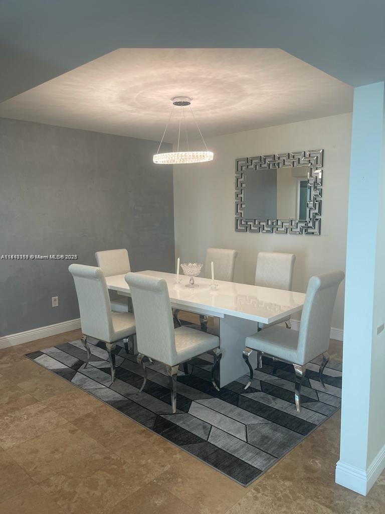 16500 Collins Avenue, Unit 652 Sunny Isles Beach, FL 33160 - Photo 4 of 6 a view of a dining room with furniture
