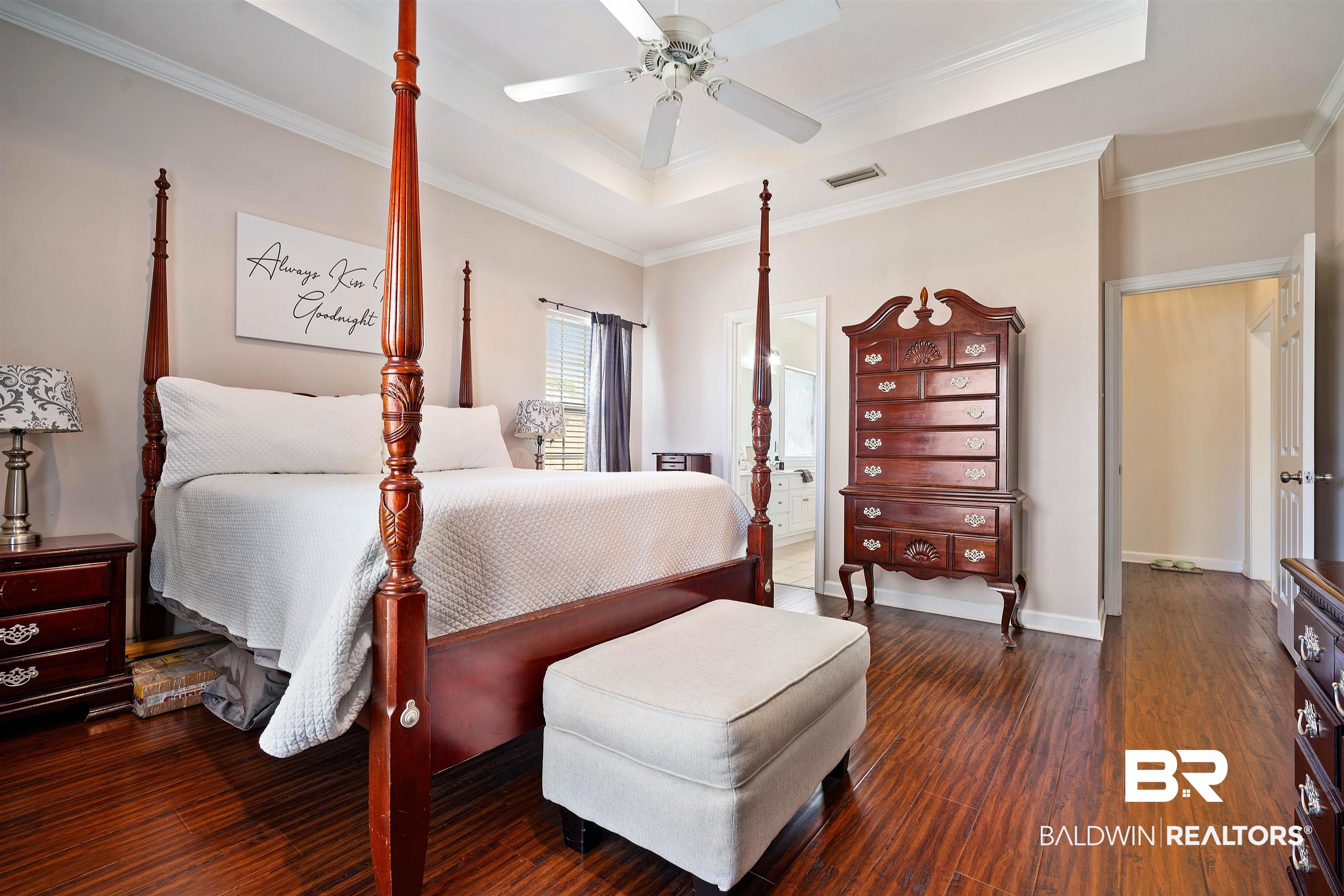 9552 White Castle Road Mobile, AL 36695 - Photo 17 of 31 Bedroom featuring a tray ceiling, wood finished floors, and ornamental molding