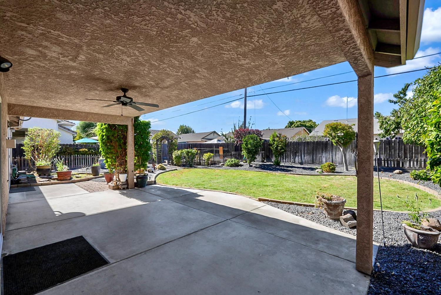 1163 Bailey Drive Ripon, CA 95366 - Photo 25 of 37 Huge covered patio with ceiling fan-perfect for outdoor relaxing and entertaining year-round.