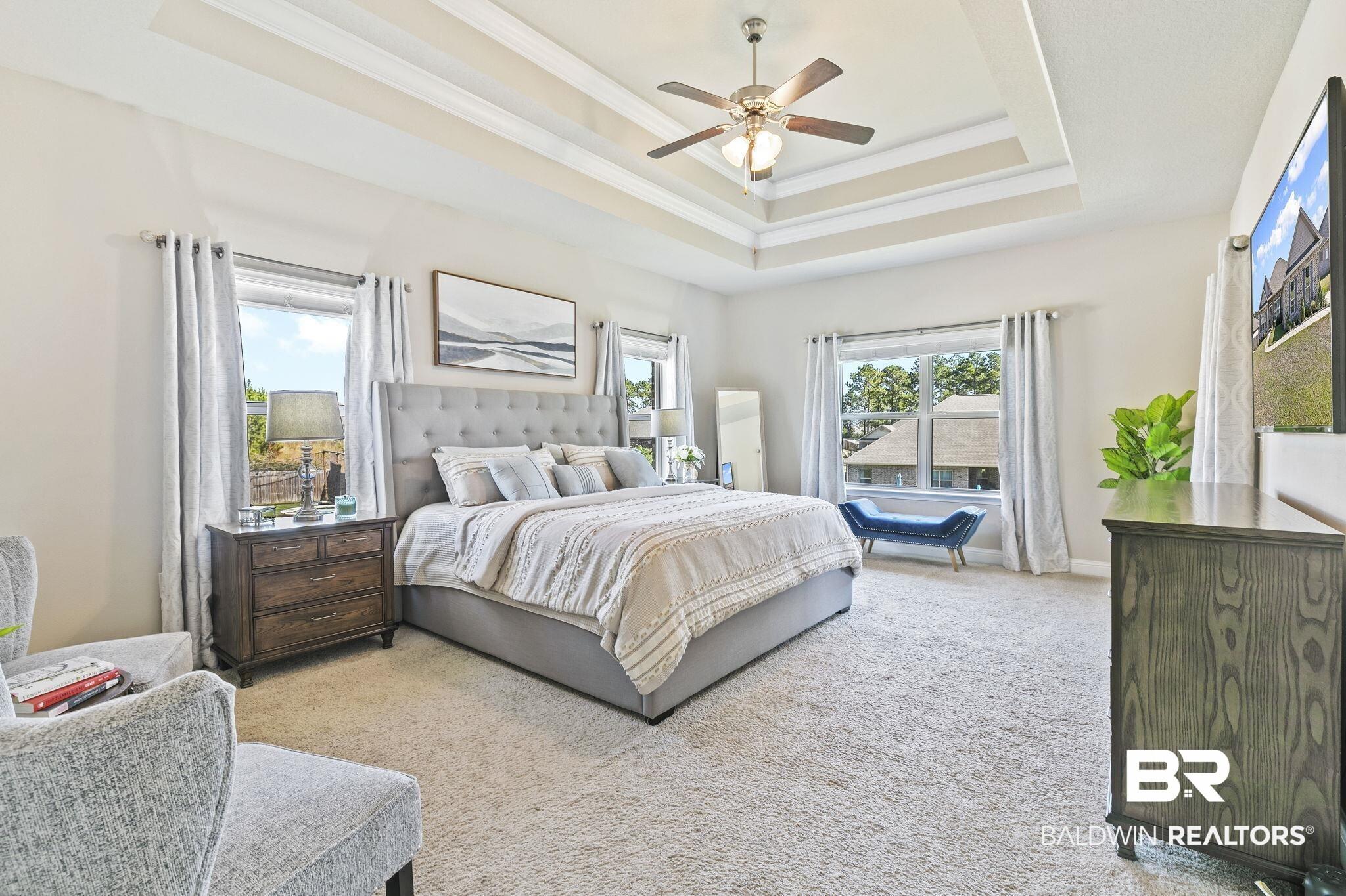 31500 Spoonbill Road Daphne, AL 36527 - Photo 25 of 85 Carpeted bedroom with ceiling fan, a raised ceiling, and ornamental molding