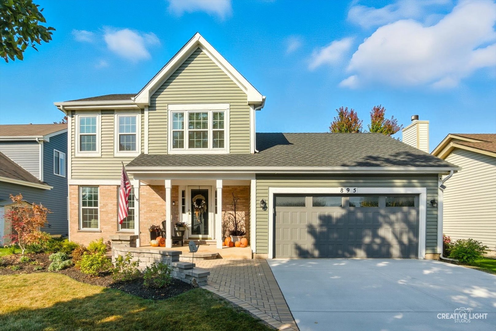 895 Lowell Lane Naperville, IL 60540 - Photo 1 of 40 front view of a house with a yard