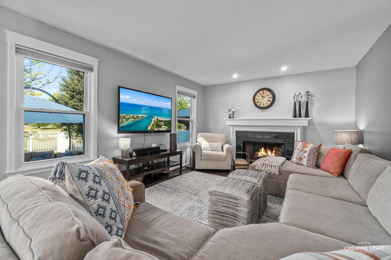 895 Lowell Lane Naperville, IL 60540 - Photo 12 of 40 a living room with furniture large window and a fireplace