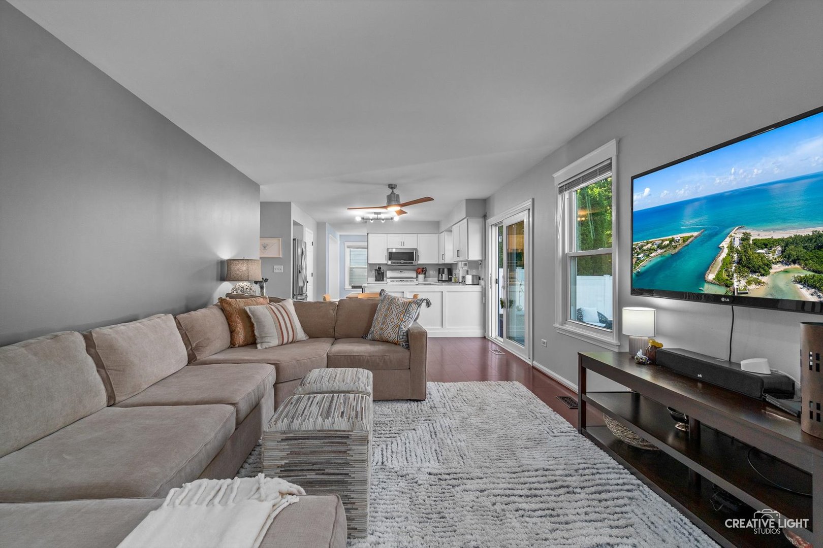895 Lowell Lane Naperville, IL 60540 - Photo 13 of 40 a living room with furniture and a flat screen tv
