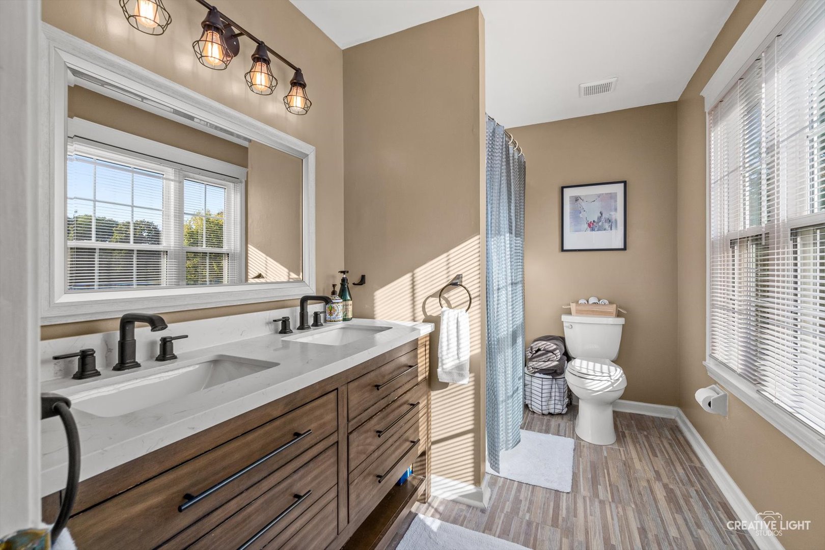 895 Lowell Lane Naperville, IL 60540 - Photo 16 of 40 a bathroom with a granite countertop toilet sink and mirror