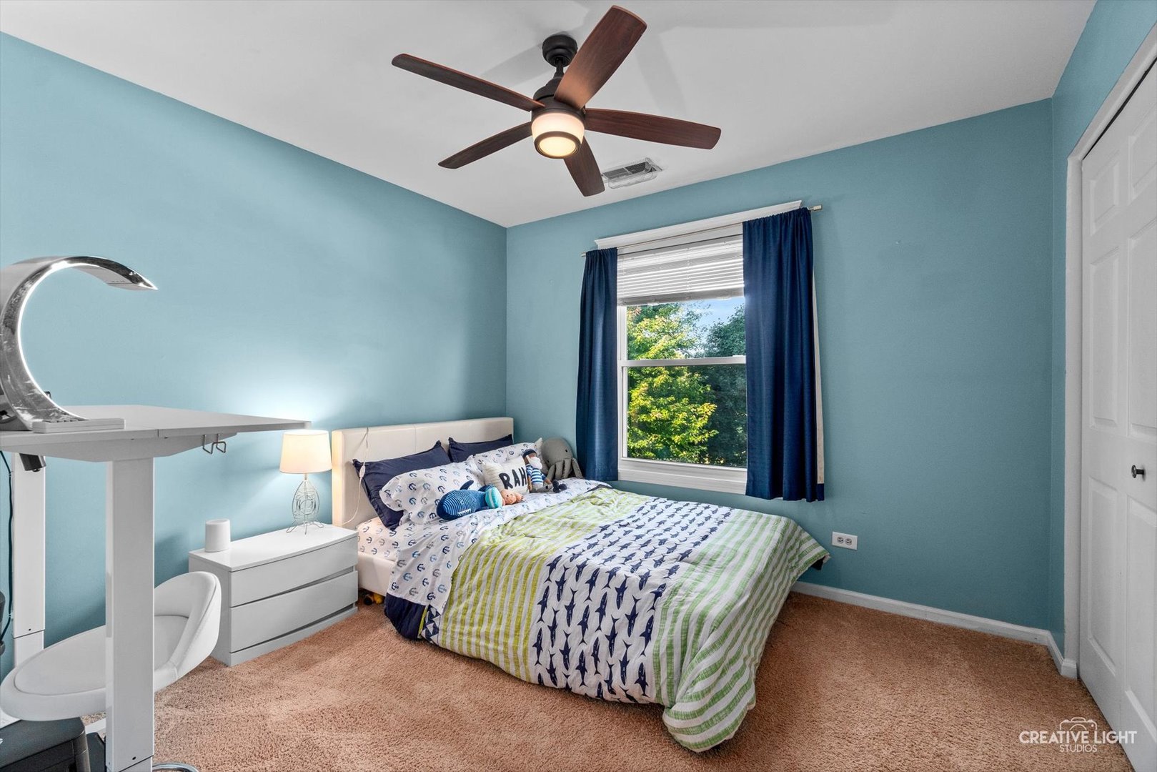 895 Lowell Lane Naperville, IL 60540 - Photo 17 of 40 a bedroom with a bed and a chandelier