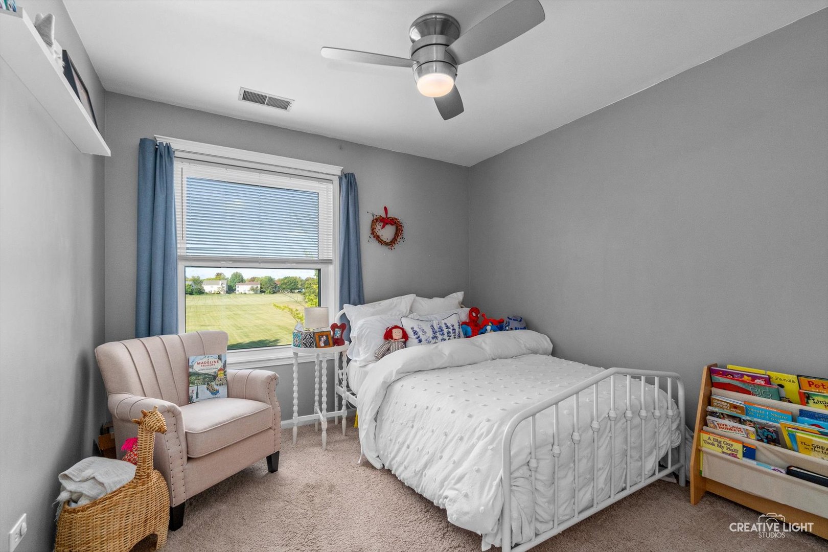 895 Lowell Lane Naperville, IL 60540 - Photo 18 of 40 a bedroom with a bed and a couch