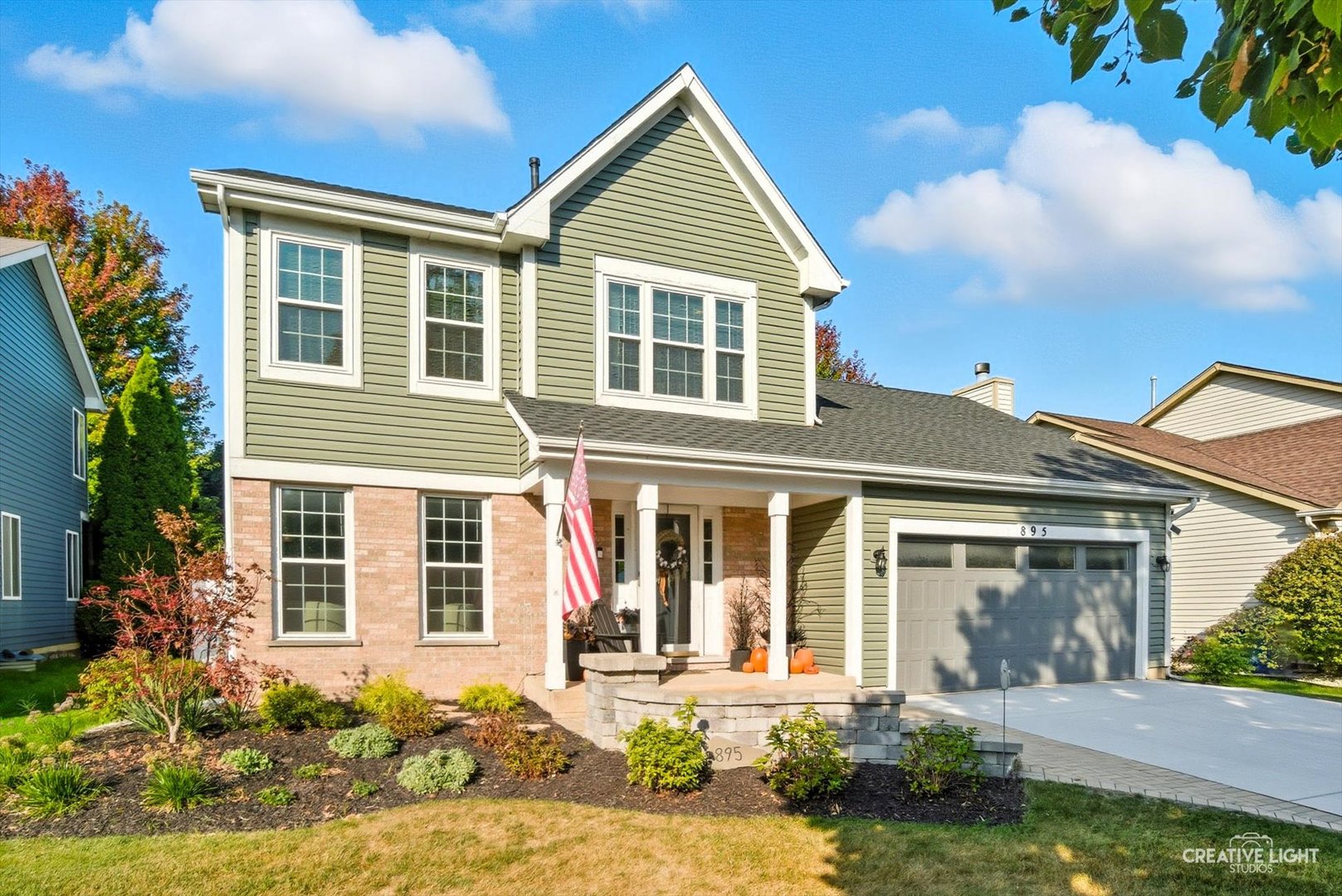 895 Lowell Lane Naperville, IL 60540 - Photo 2 of 40 front view of a house with a yard