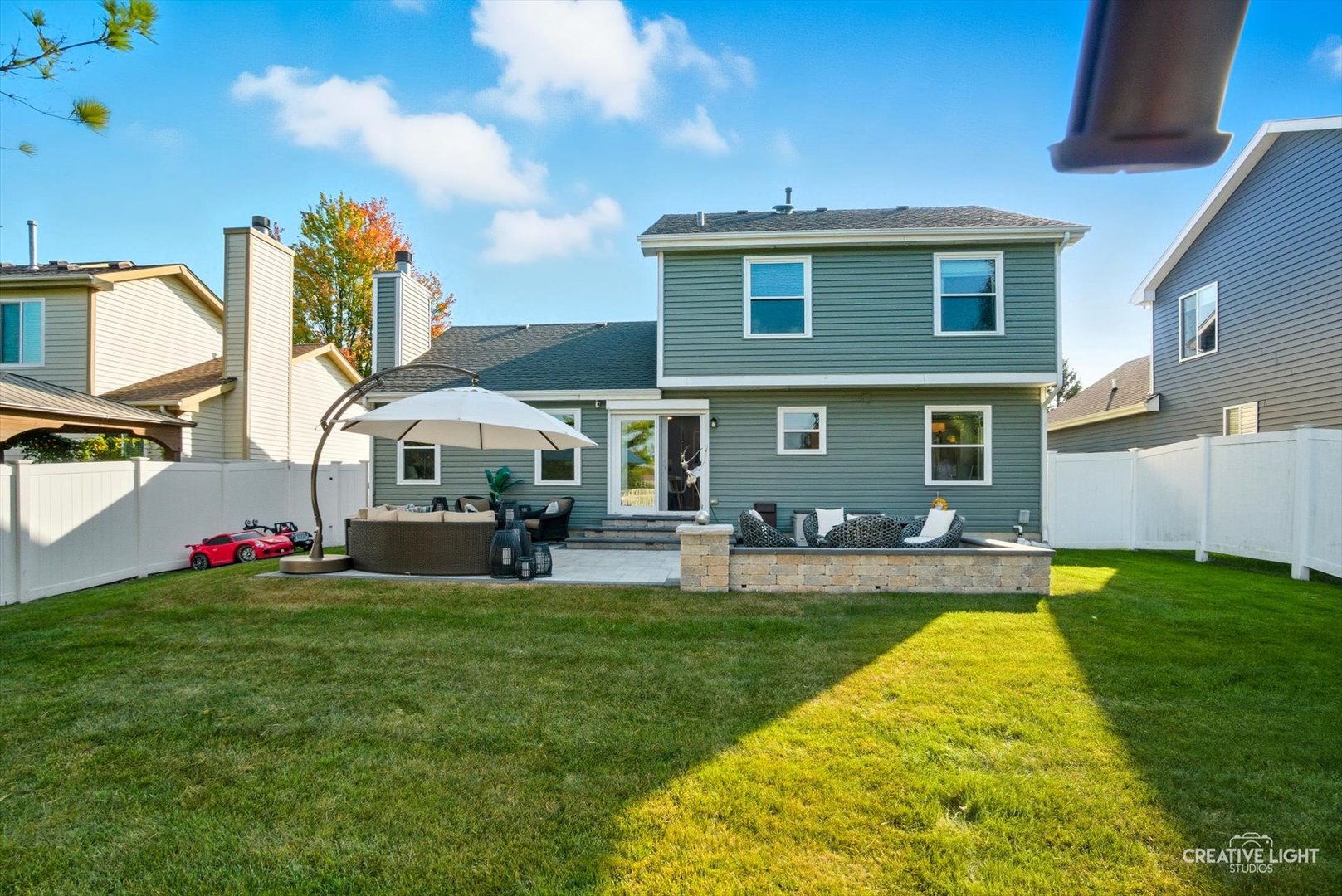 895 Lowell Lane Naperville, IL 60540 - Photo 24 of 40 a view of a house with a yard porch and sitting area