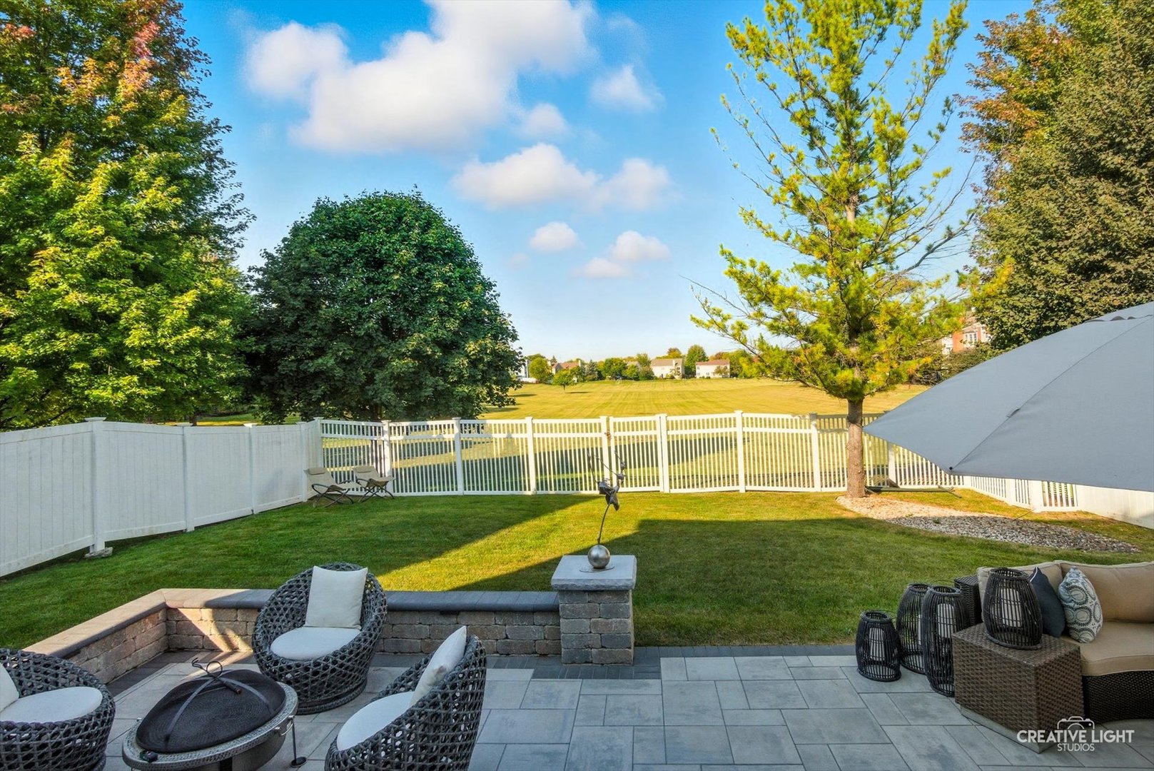 895 Lowell Lane Naperville, IL 60540 - Photo 27 of 40 a view of a swimming pool with a patio