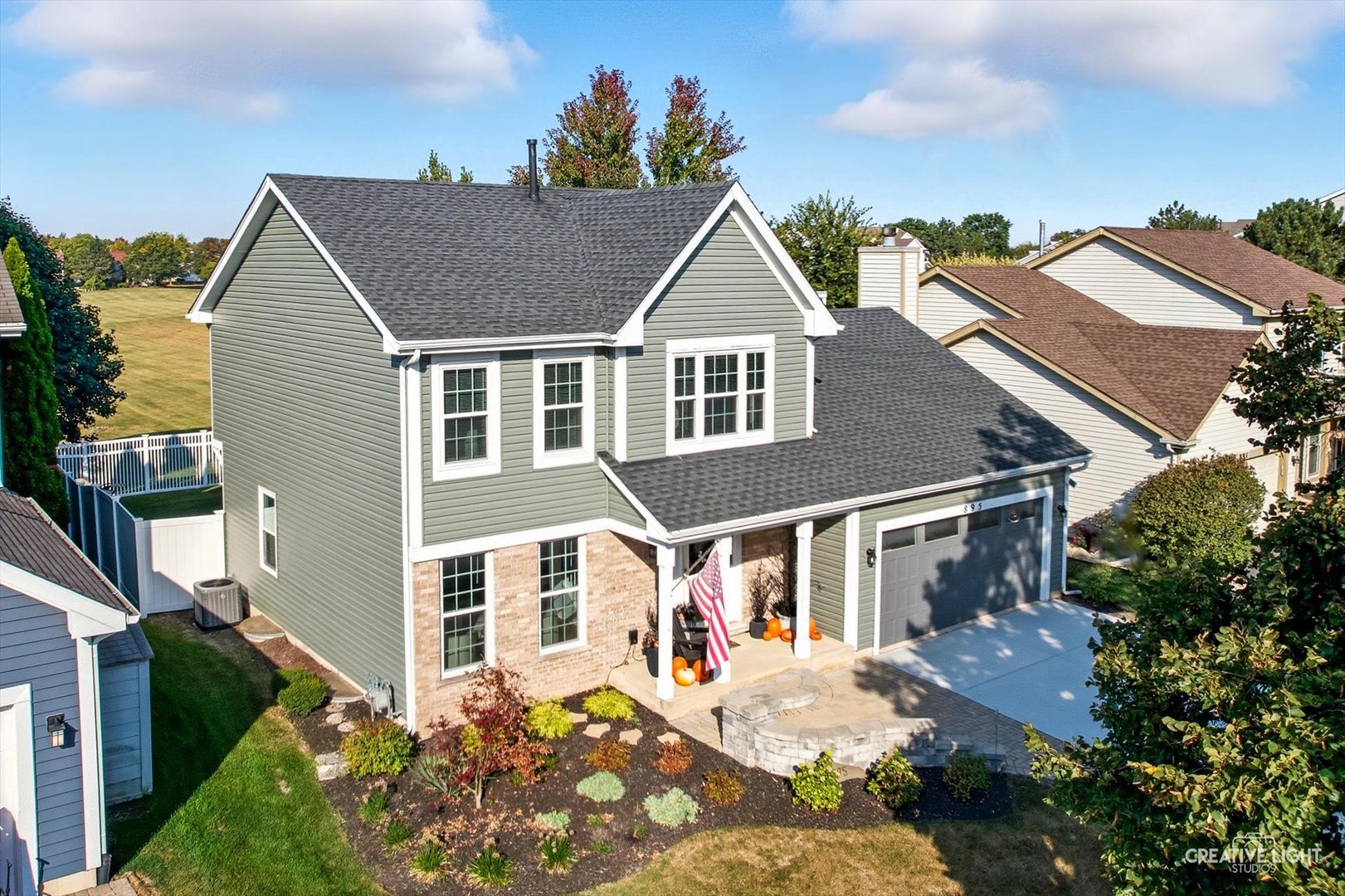 895 Lowell Lane Naperville, IL 60540 - Photo 35 of 40 a front view of a house with a yard