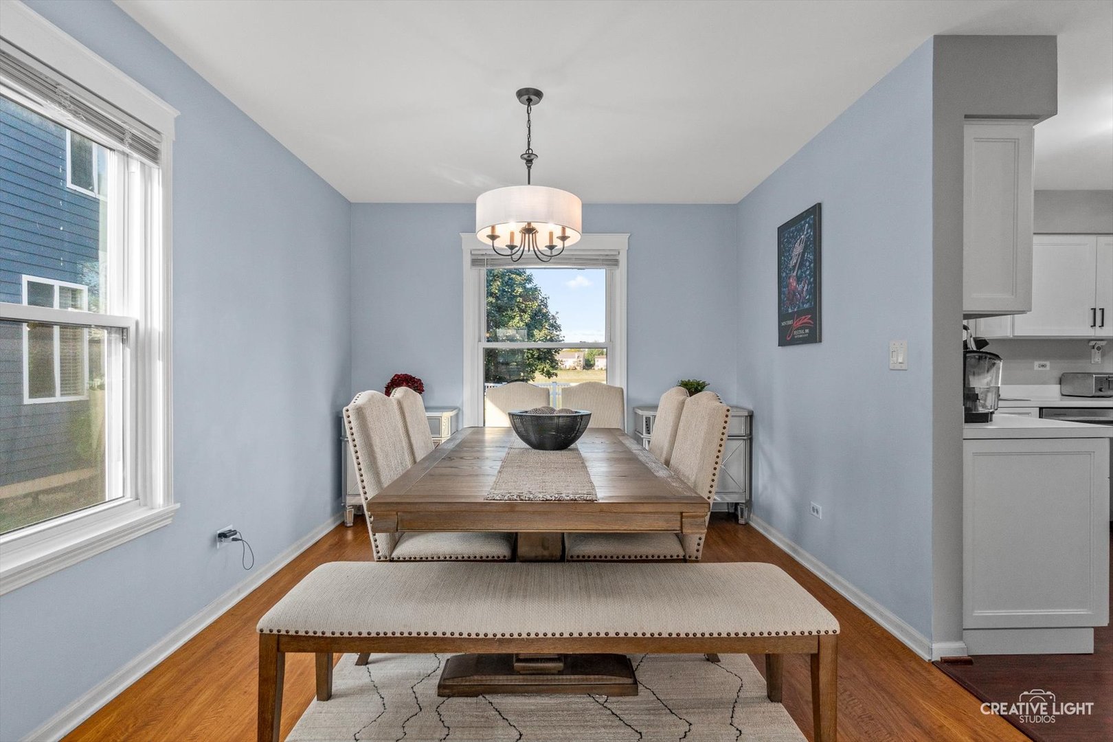 895 Lowell Lane Naperville, IL 60540 - Photo 6 of 40 a view of a dining room with furniture window and wooden floor