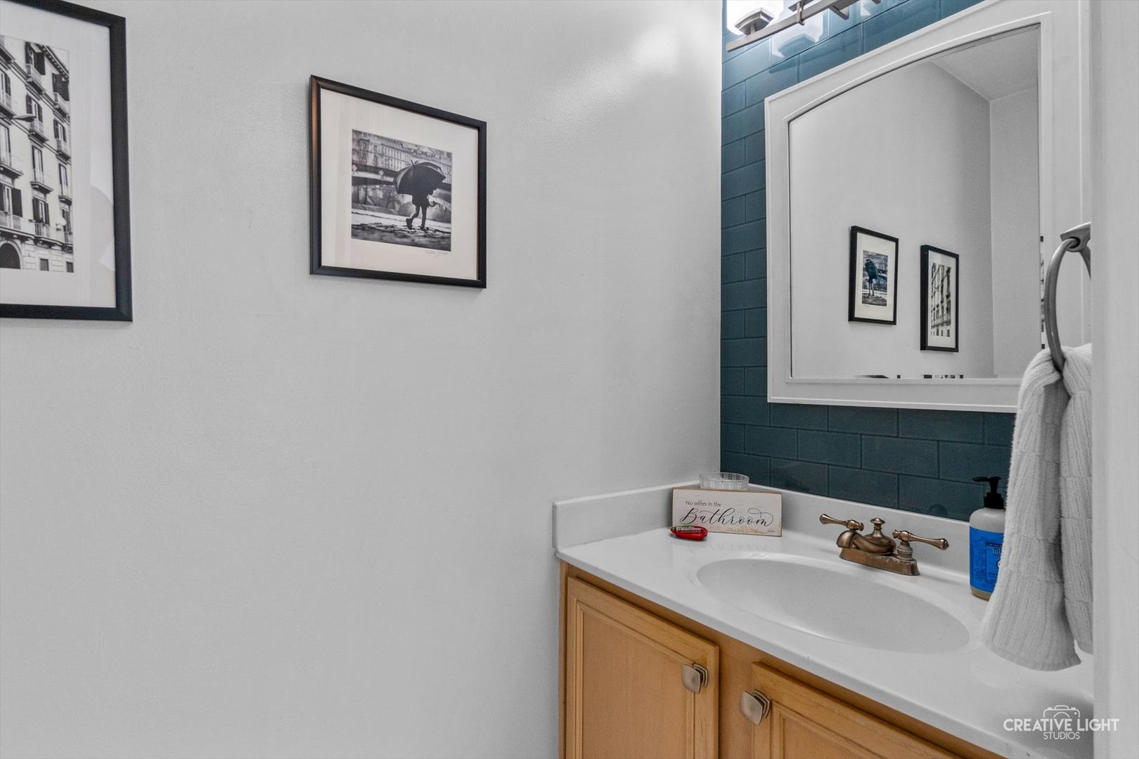 895 Lowell Lane Naperville, IL 60540 - Photo 7 of 40 a bathroom with a sink and a mirror
