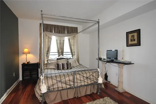 a bedroom with furniture and a window